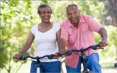 Happy couple riding a bycicle
