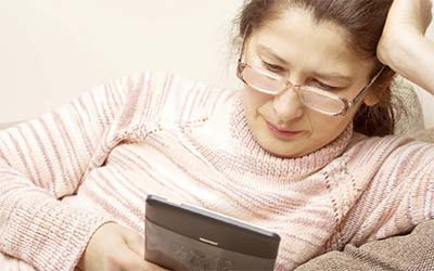 Woman reading on a tablet device