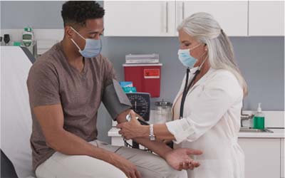 Doctor monitoring a patient's blood pressure